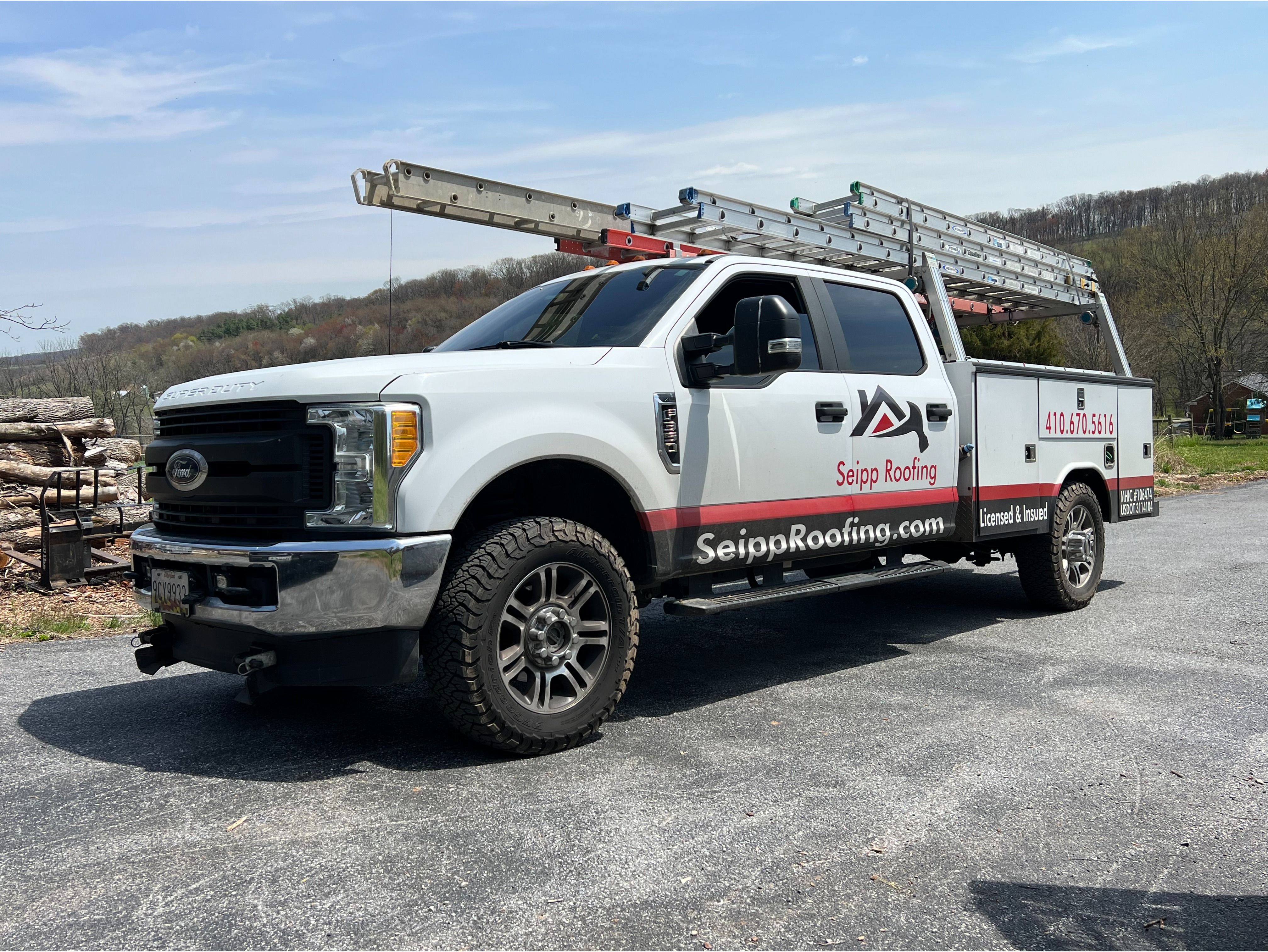 Branded Seipp Roofing service truck equipped with ladder racks and field equipment, supporting roofi 
