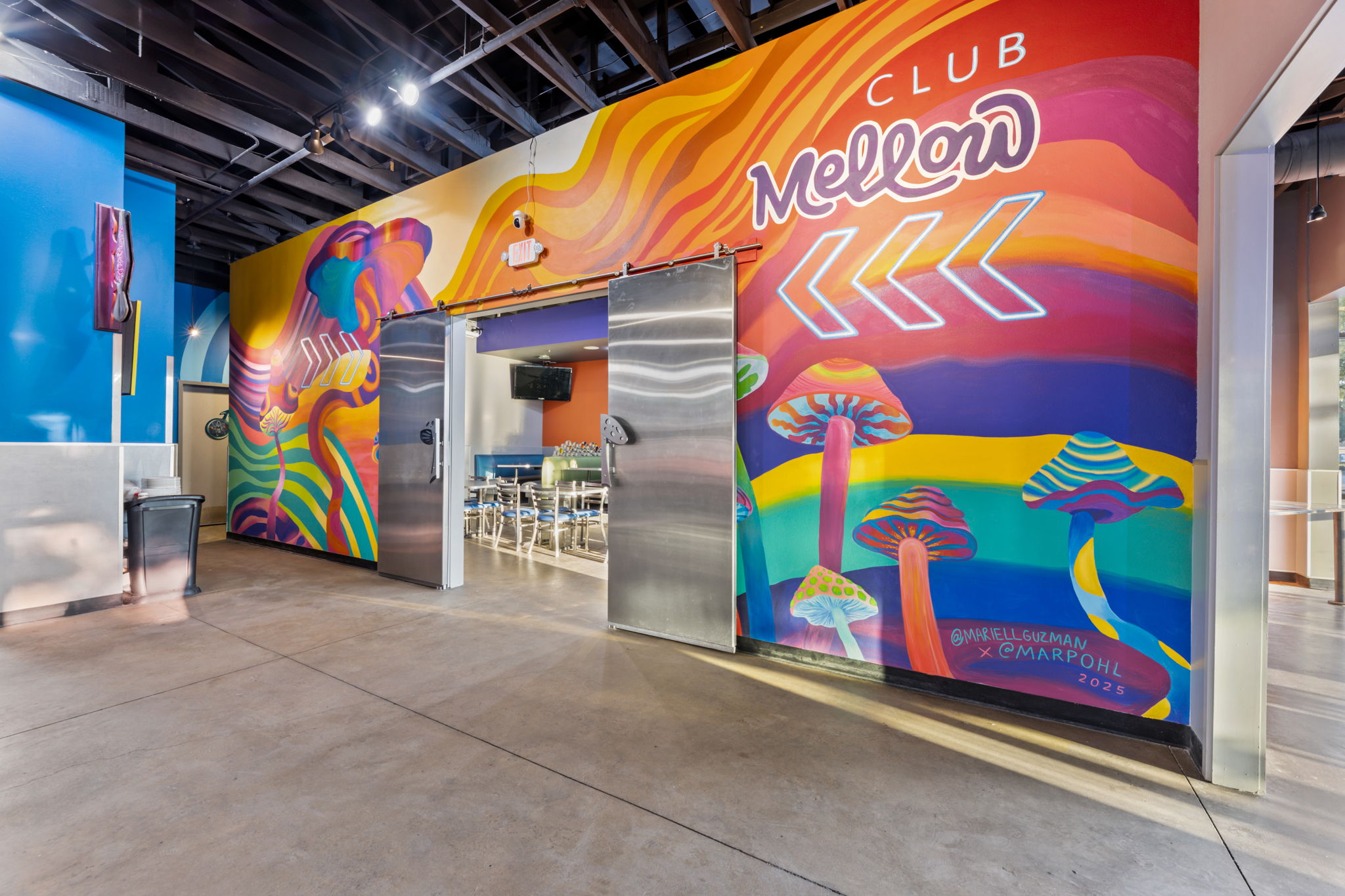 mellow mushroom Arlington entrance to private dining room with mushroom mural on wall