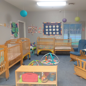 Bright and colorful preschool classroom at Childcare Network with age-appropriate learning materials