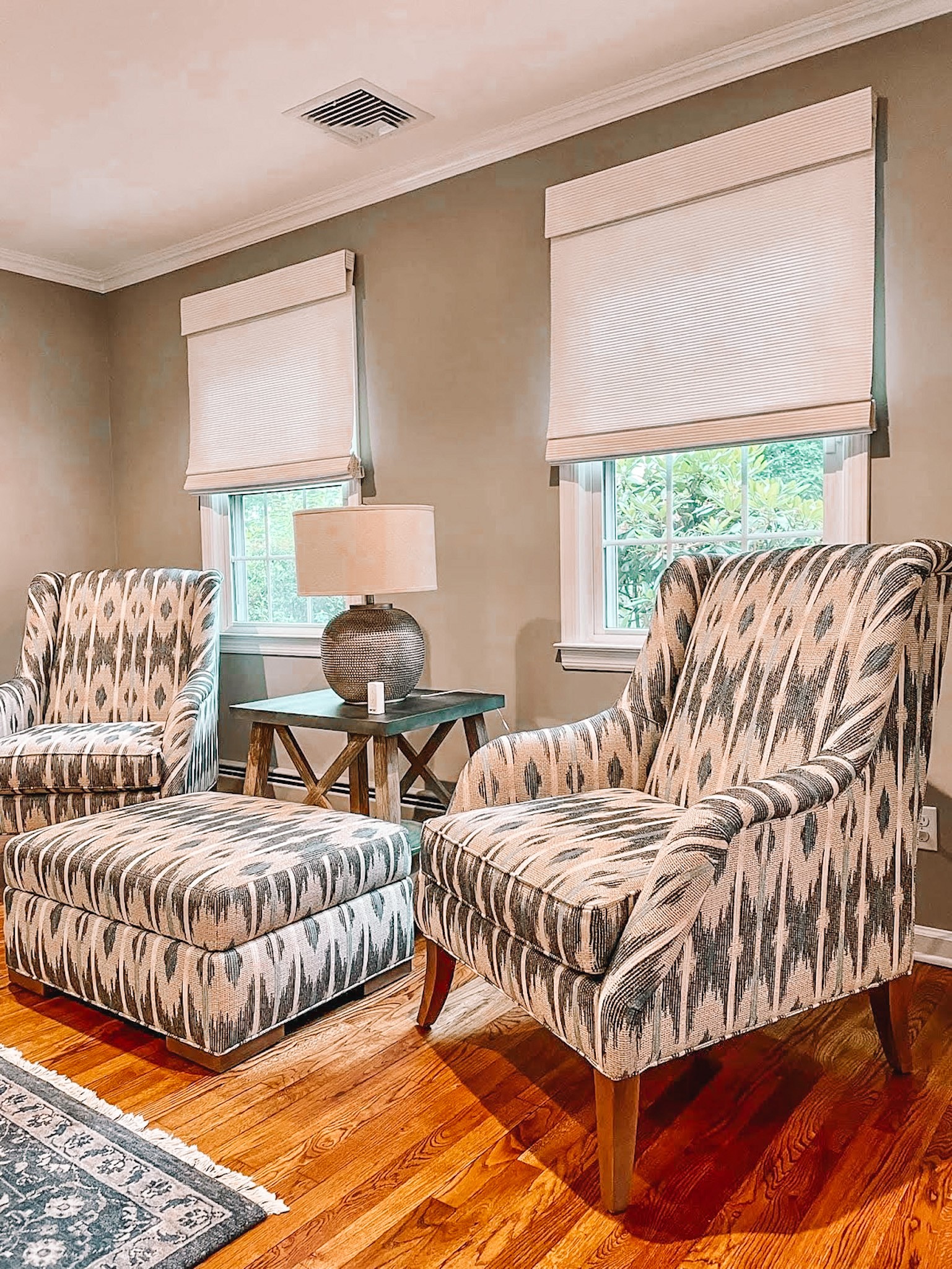 Finish your sitting room with the perfect shade, such as these woven woods seen here in Holmdel, NJ