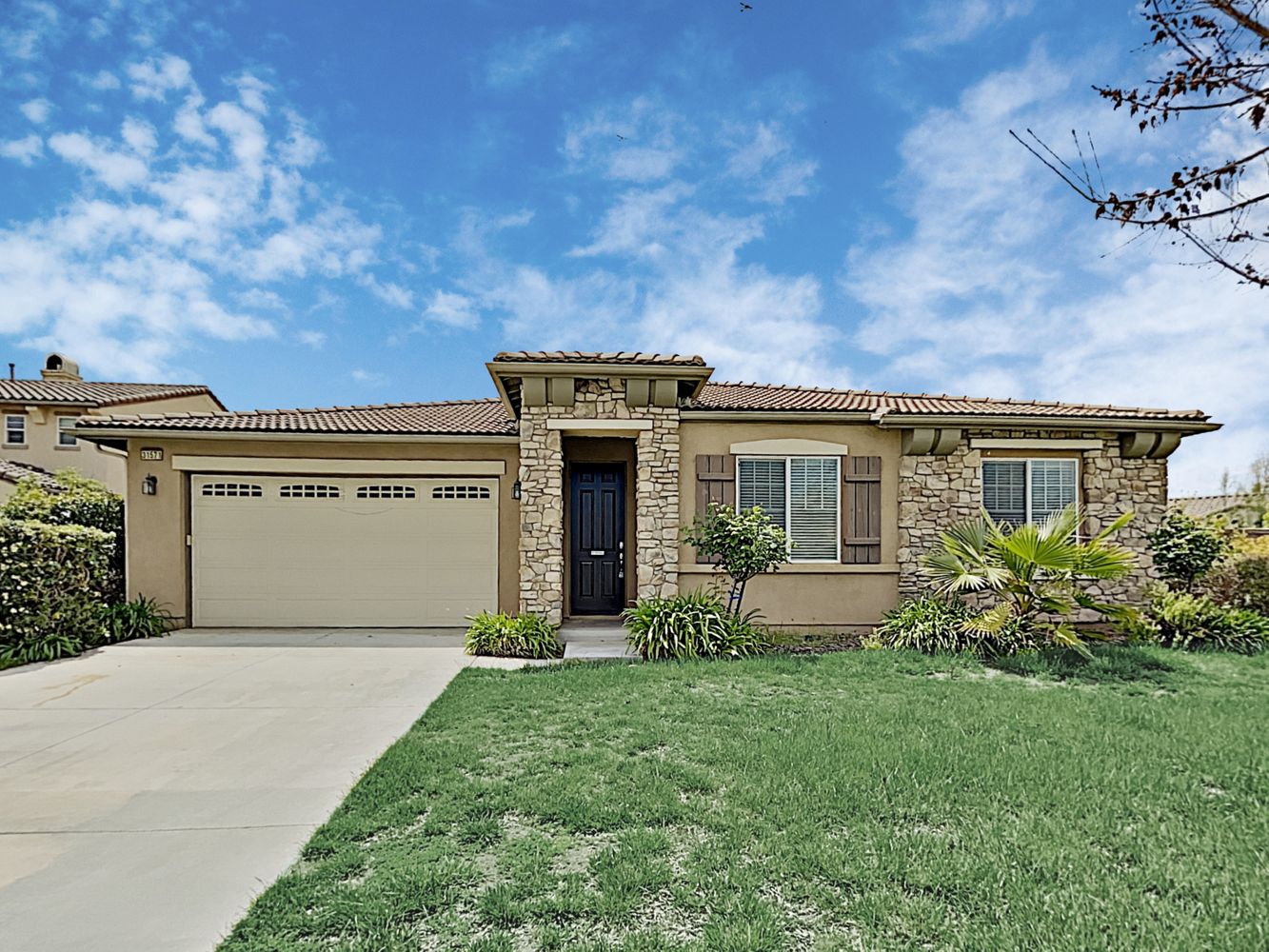 Front of home with two-care garage  at Invitation Homes Southern California.