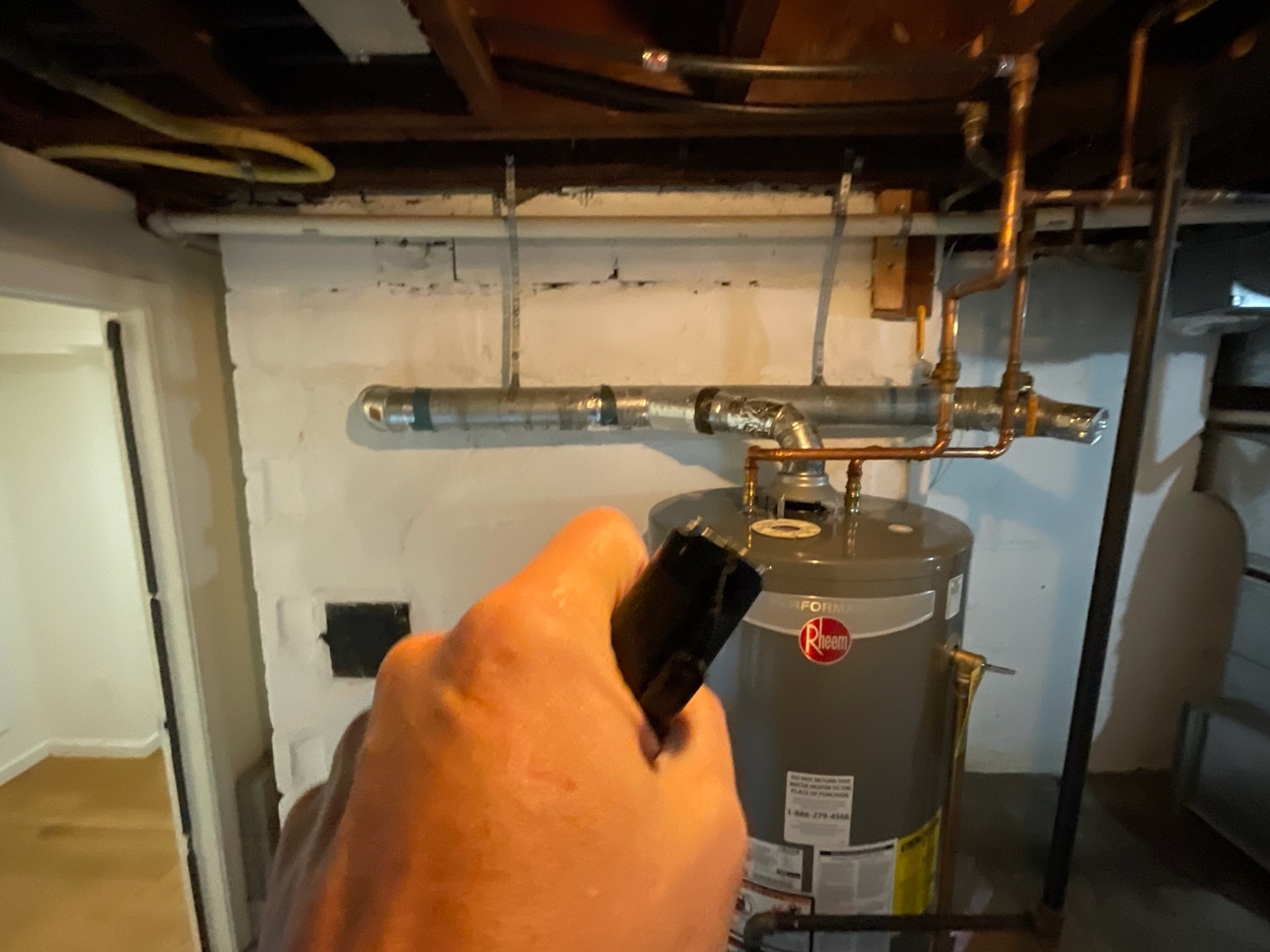 It's unsafe to have an appliance vent that is flat or sloped negatively to the chimney like this one. It should be sloped 1/4" per foot.