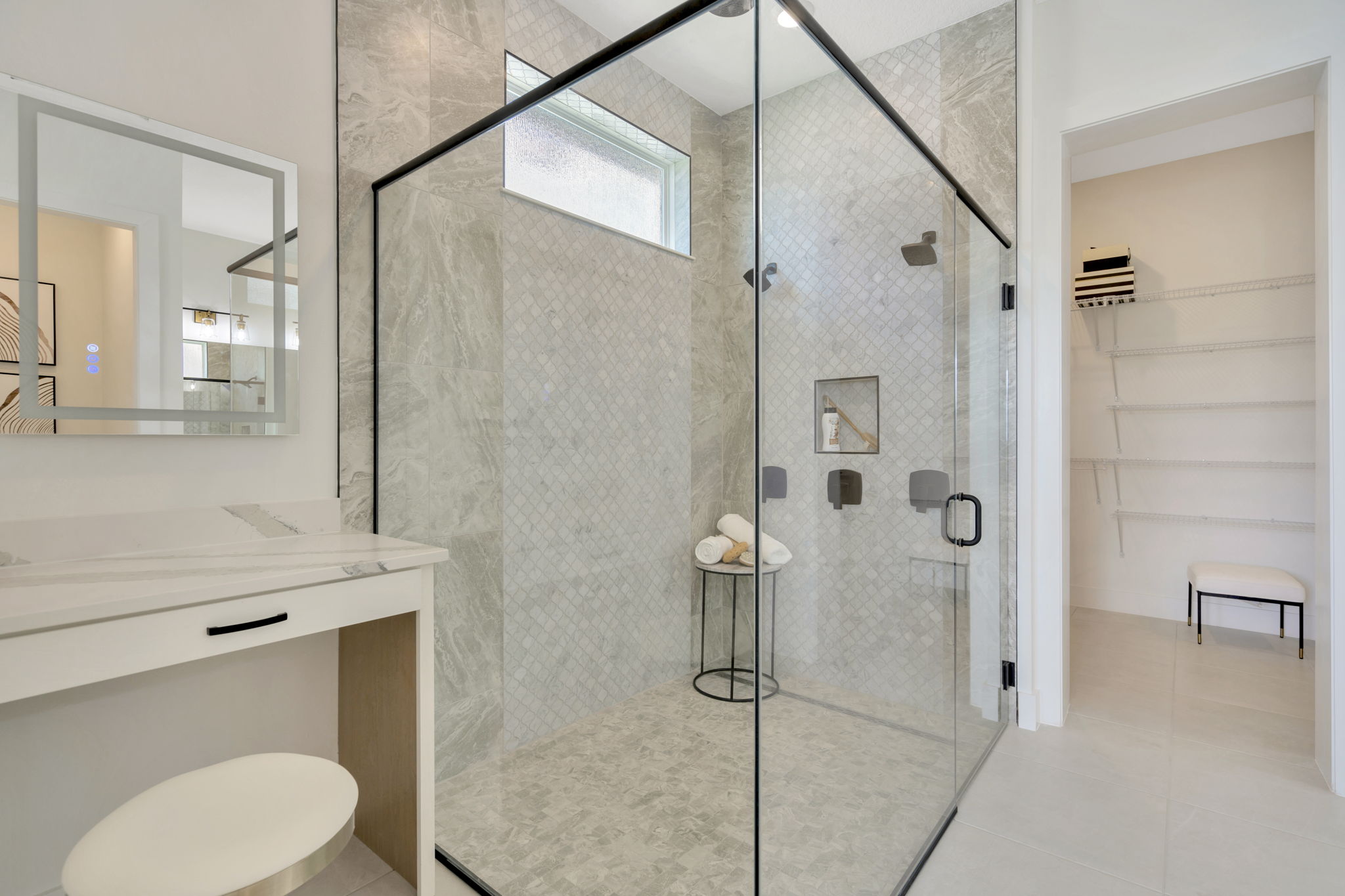 The Primary Bathroom of a DRB Homes Eider Home Plan at Biscayne Landing at Seaire in Parrish, FL.
