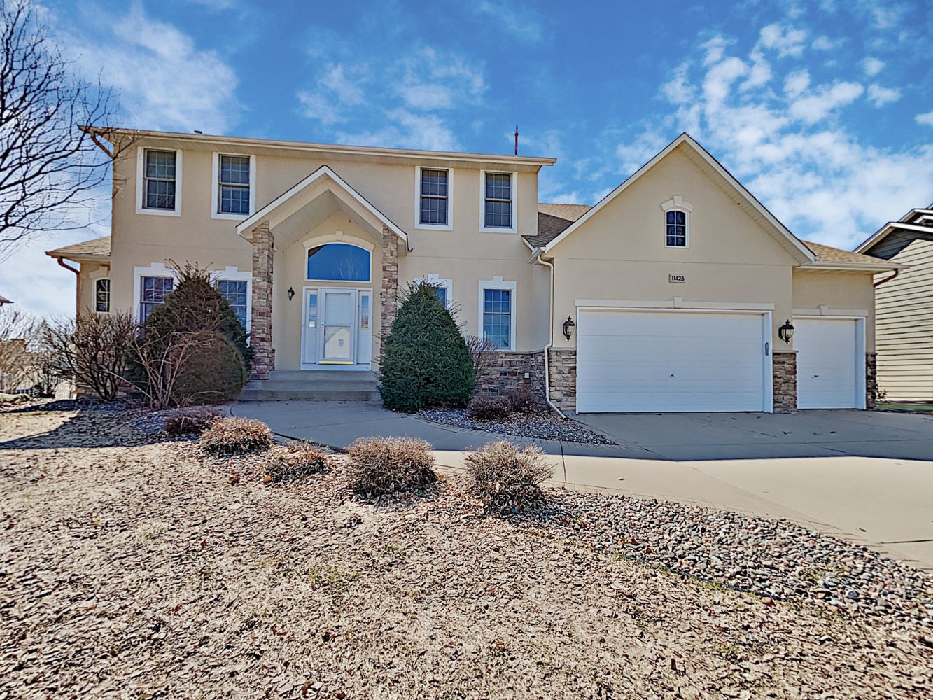 Beautiful two-story home with a three-car garage at Invitation Homes Minneapolis.