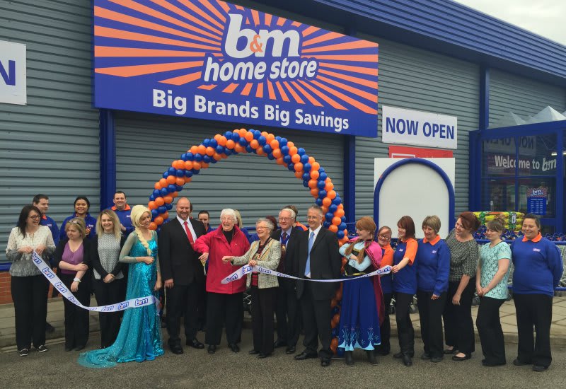 Store manager Andy Cowper-Johnson is joined by Councillor Alison Austin who cut the ribbon with B&M Local Hero Nora Sparling of Butterfly Hospice.