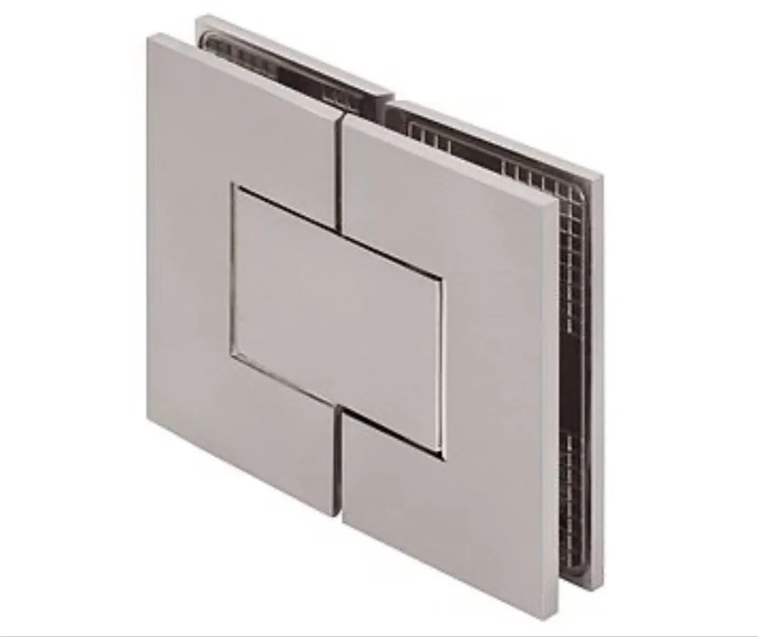 A close-up studio shot of a brushed metal glass-to-glass hinge. The hinge is square with a rectangular cutout in the center. The hinge is designed to attach two glass panels together, likely for a shower door or a display case. The metallic finish has a subtle sheen.