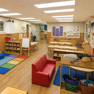 Bright and colorful preschool classroom at Childcare Network with age-appropriate learning materials 