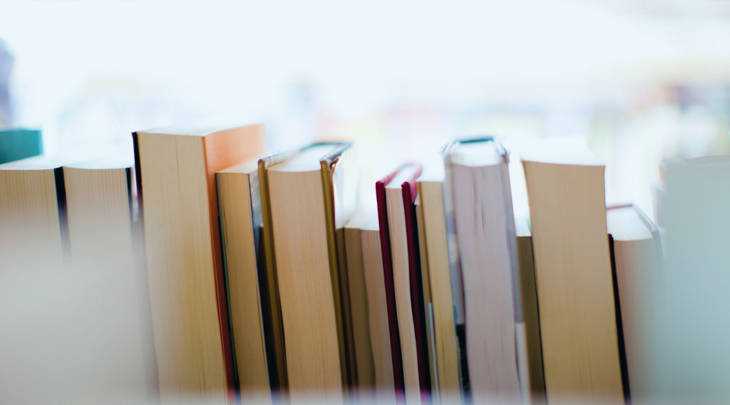 Close-up shot of books on a shelf.