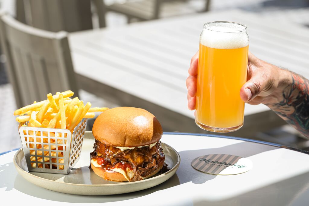 The game doesn&rsquo;t end on the course at Matchplay Kitchen + Bar, it continues with a cold glass and a well-earned bite in the sunshine.