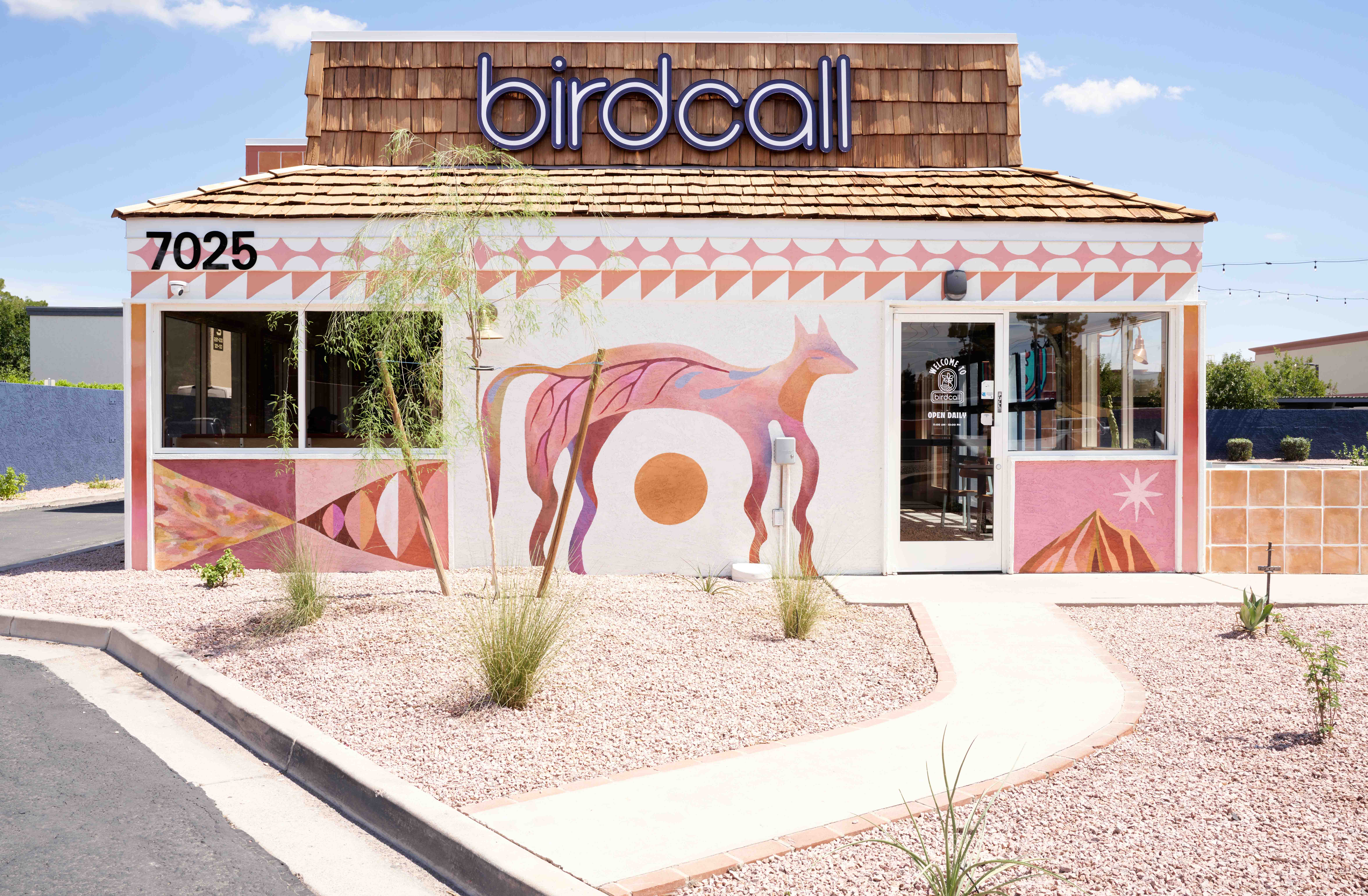 Exterior of Birdcall 7th & Glendale featuring a mural by Lindee Zimmer.