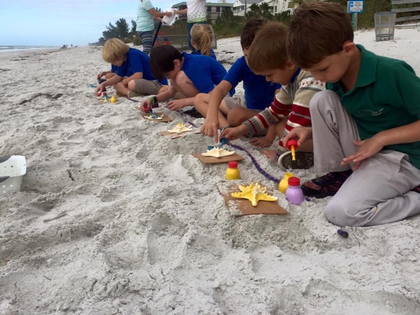 Students learning at the beach