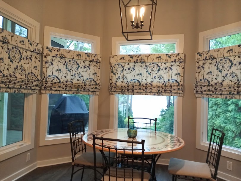 We installed these beautiful cordless Roman Shades in this breakfast nook to bring some life and brightness to the space. The advantage of the cordless shades is they are easy to operate up so that the view to the lake can be fully appreciated or down so as to create a cozy and private space.