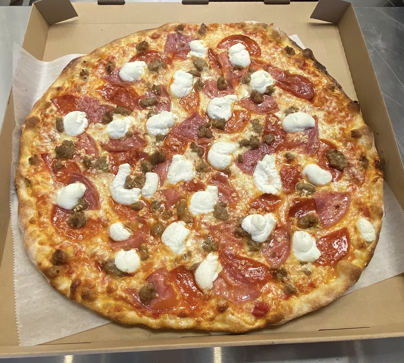 Tomato sauce, shredded mozzarella & provolone blend, pepperoni, salami, Italian sausage, fresh garlic, ricotta, and fresh grated Pecorino Romano.