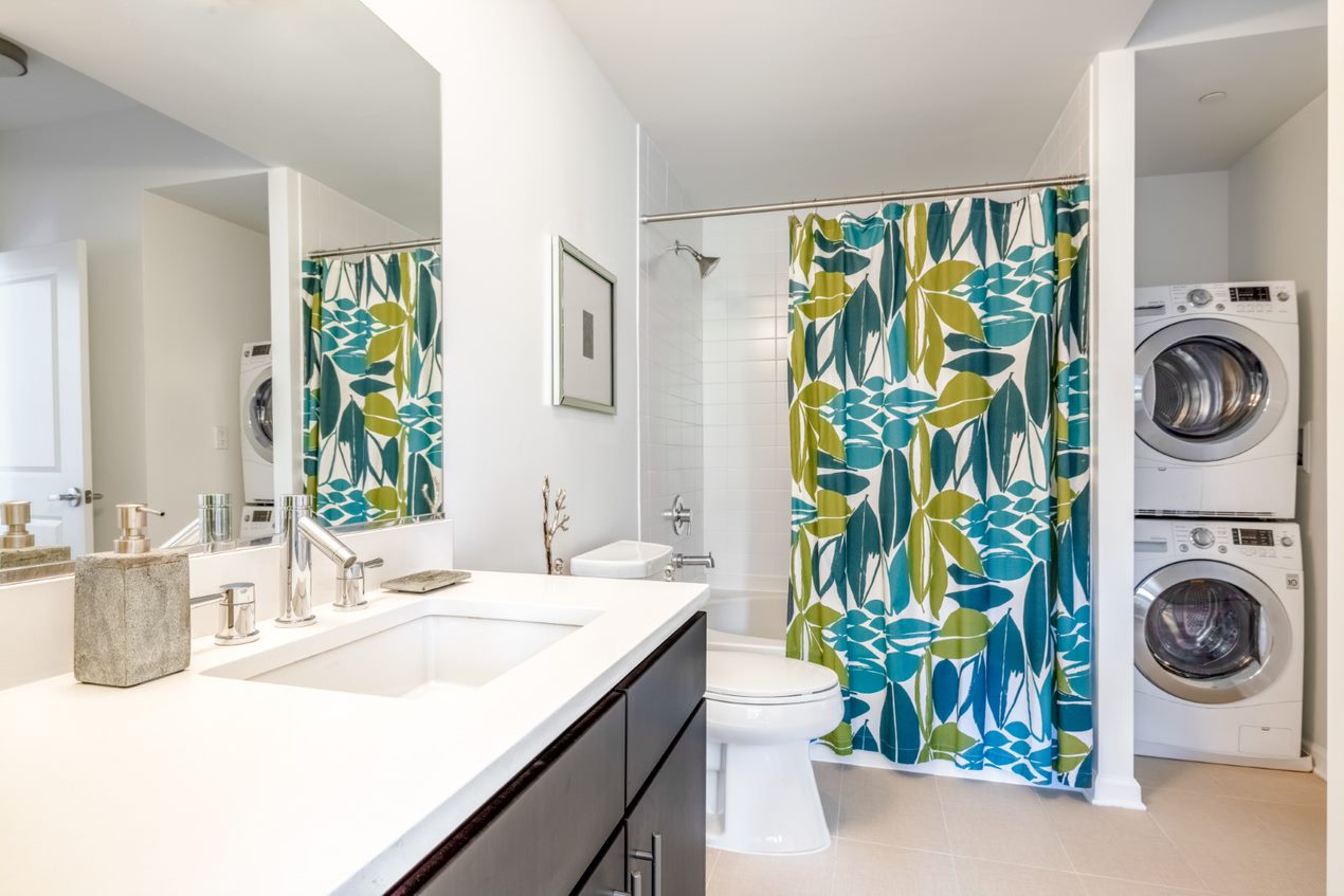 Ceramic linen tile bathrooms and in-home washer and dryer