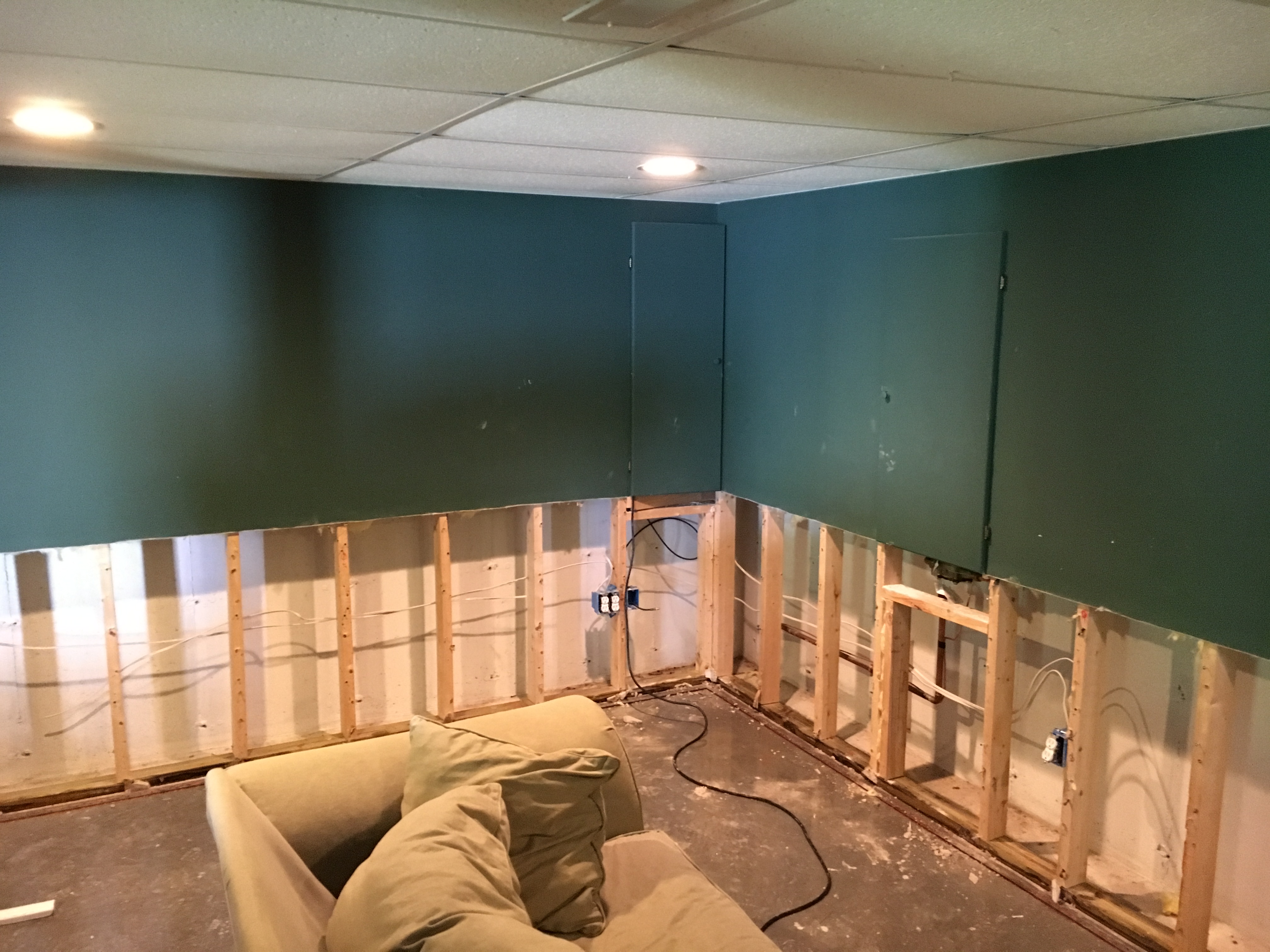 After water damage to this Milford, NH homes basement the drywall needed to be removed to expose the wall. The water had wicked up the walls about 30 inches. Opening the walls allows for proper drying of the studs and floor plate.