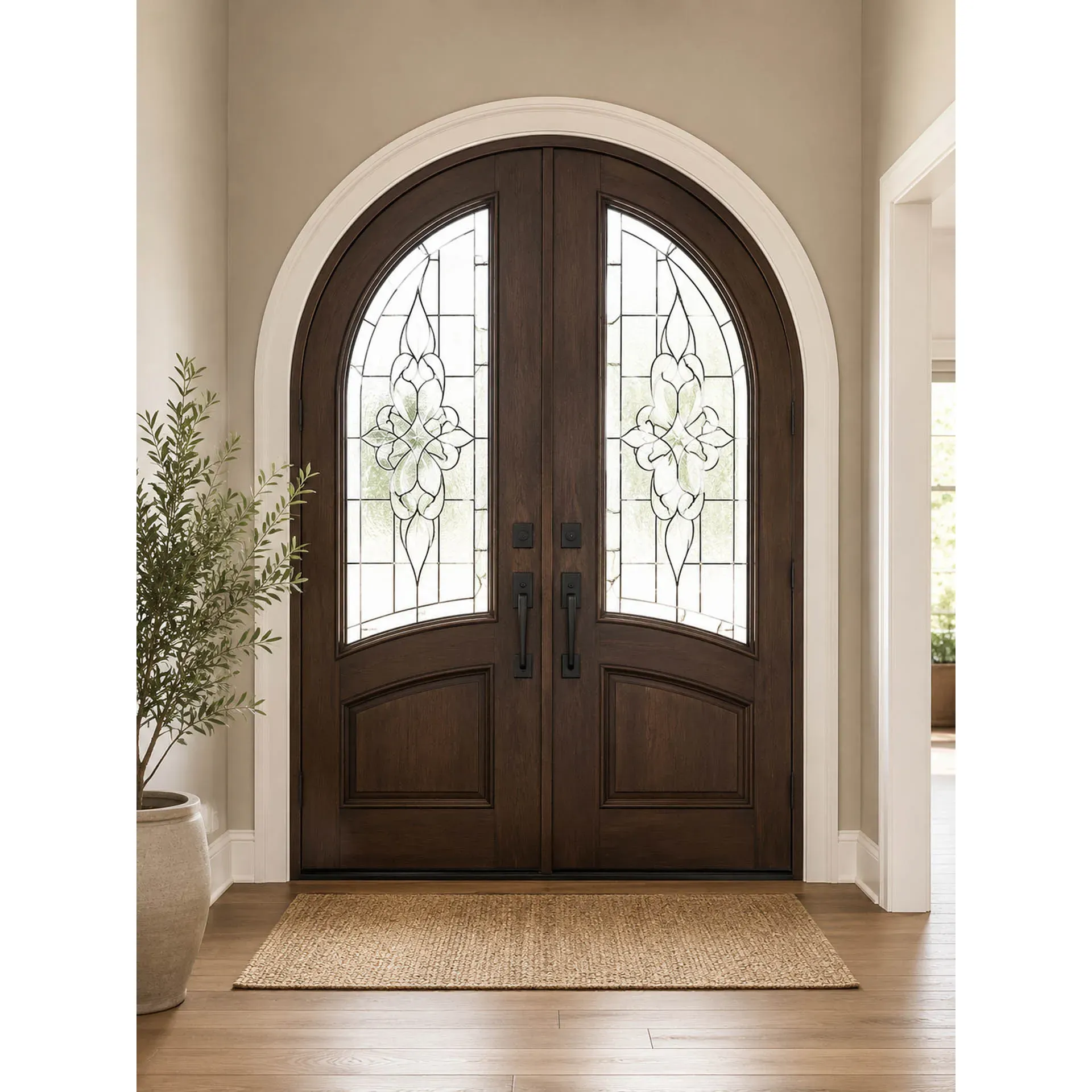 Luxury Arched French Entry Doors: Stunning, custom-arched dark wood French entry doors with elegant decorative glass and modern matte black hardware.