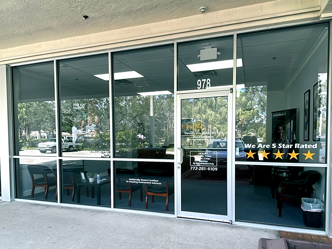 Exterior photo of the front door for AudioNova hearing clinic in Port St. Lucie, FL