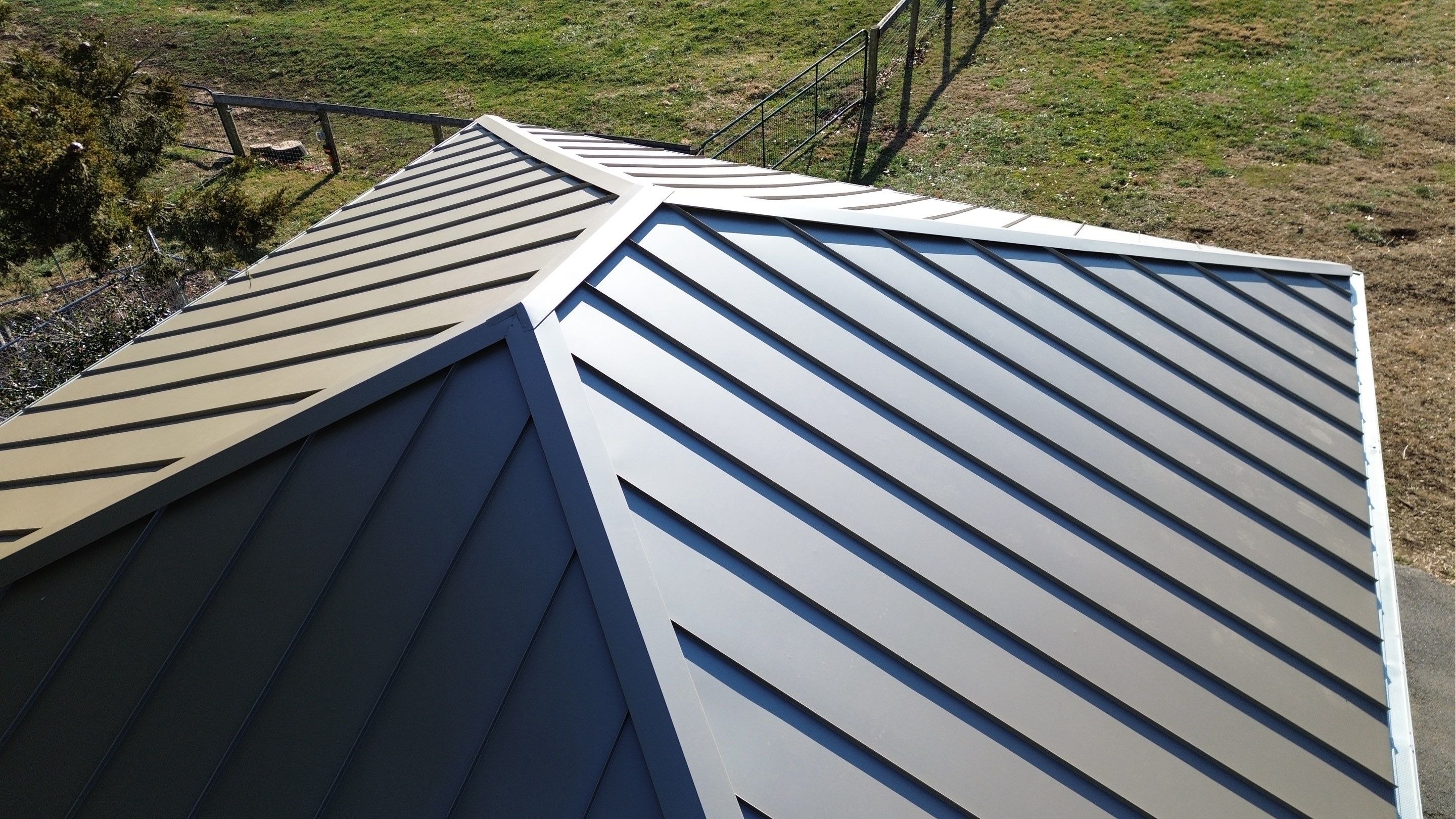 Close aerial detail of an Englert standing seam metal roof in Westminster, Maryland, showing the com 