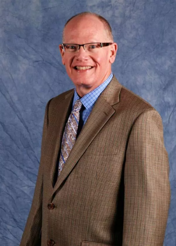 Professional portrait of elder law and estate planning attorney John R. Frazier. 