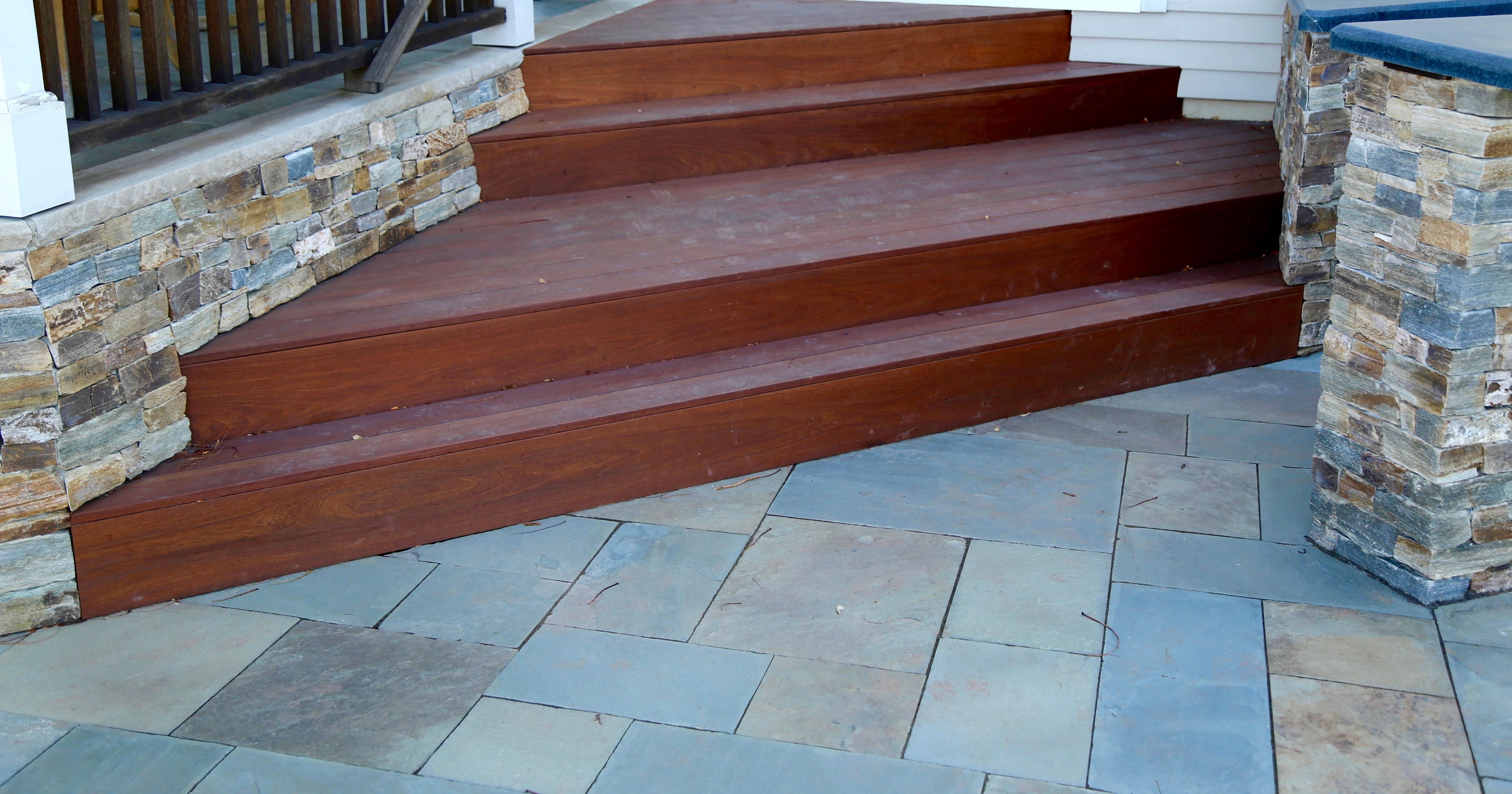 Site constraints and existing features often make the design process more challenging. They can also drive creative and unique design solutions. This challenge involved creating a new step layout that functioned seamlessly with the back door, existing raised porch and the new outdoor gourmet kitchen. We replaced the existing square steps and railing with these triangular Brazilian Walnut steps with a landing in the middle eliminating the need for a new railing which would have interrupted the flow of the space! www.gardenartisansllc.com 609-371-0099  siteconstraints  designprocess  creative  unique  designsolutions  newsteps  raisedporch  gourmet  outdoorkitchen  steps  railings  brazilianwalnut  ipe  outdoorspace  naturalstone  veneer  bluestone  soapstone  landscapedesign  landscapearchitecture