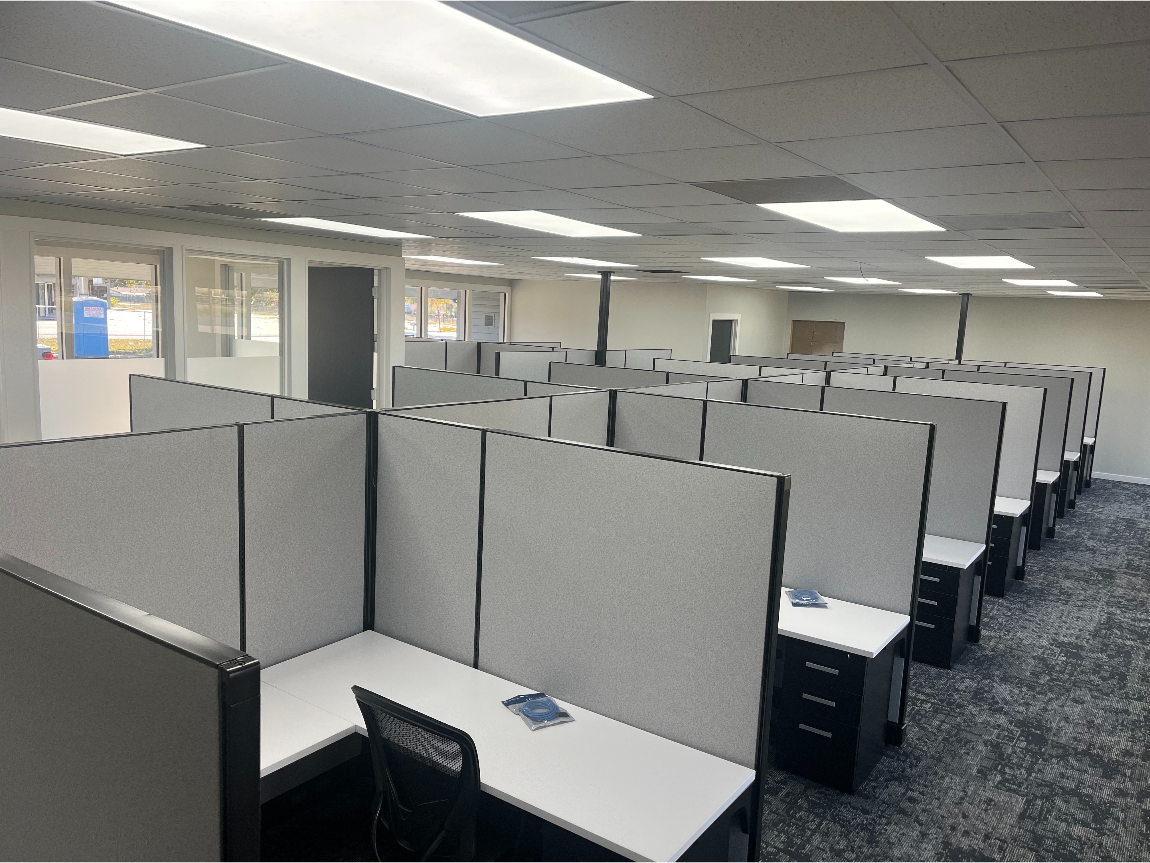 Glass-Top Cubicle Layout:

Premium office cubicles featuring frosted glass top-stackers on acoustic fabric panels for natural light airflow and privacy.