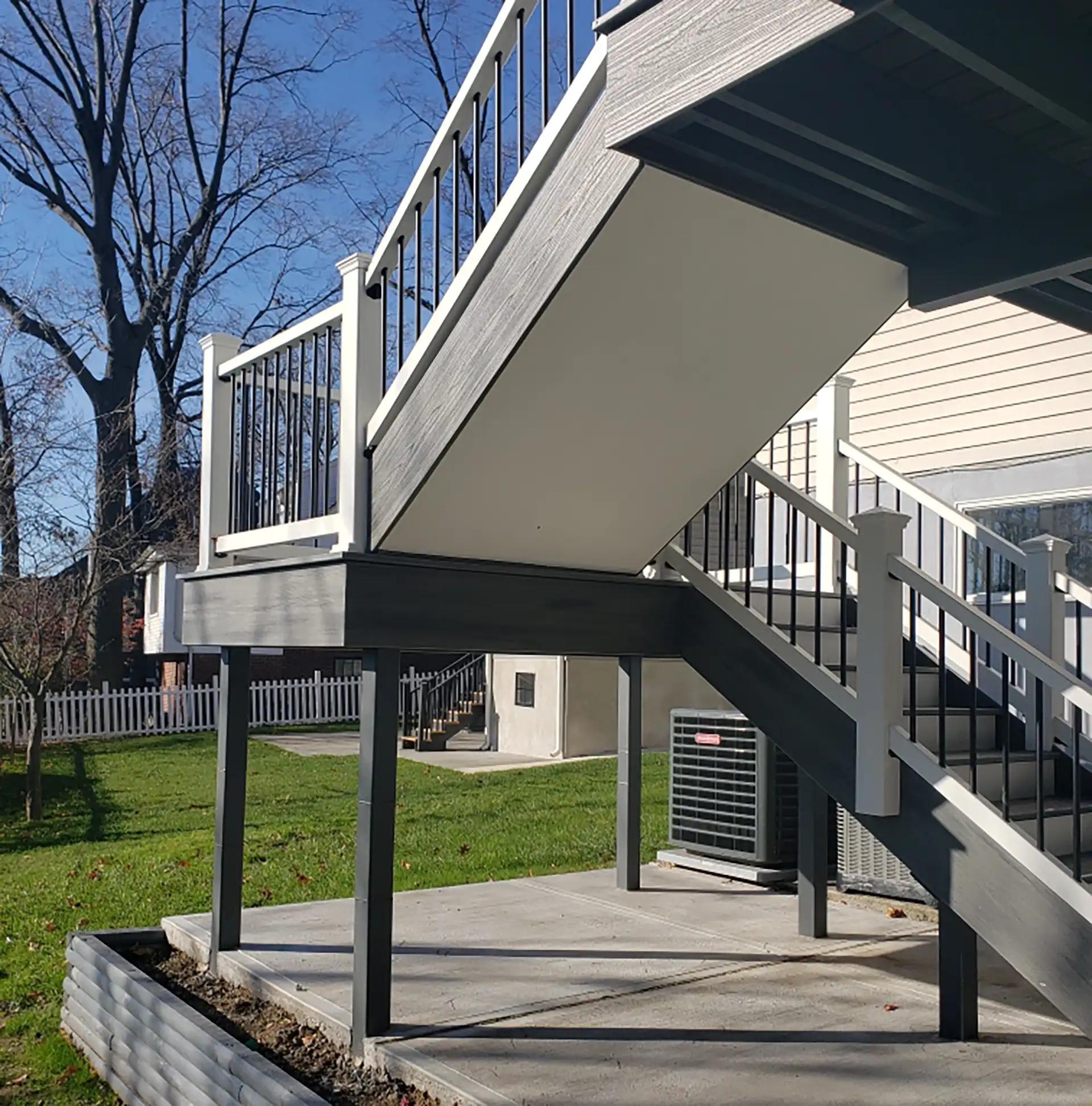 Composite Deck Stairs with Railings built by Decks By Murray