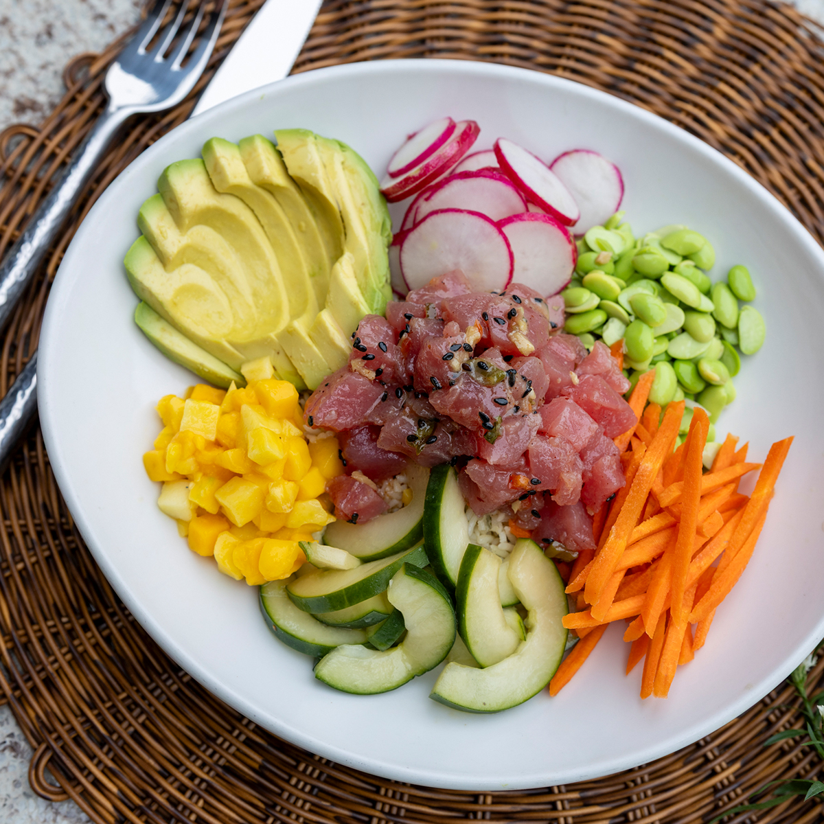 Tuna Poke Bowl | mango, avocado, radish, carrots edamame, cucumber, vinaigrette