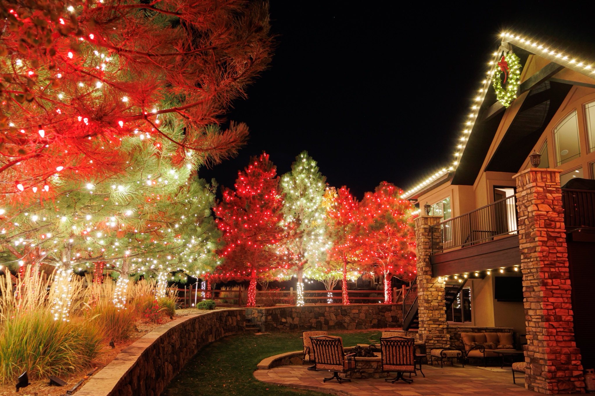 Rear garden lighting. The retaining wall and fire pit terrace are lit as carefully as the front elev 