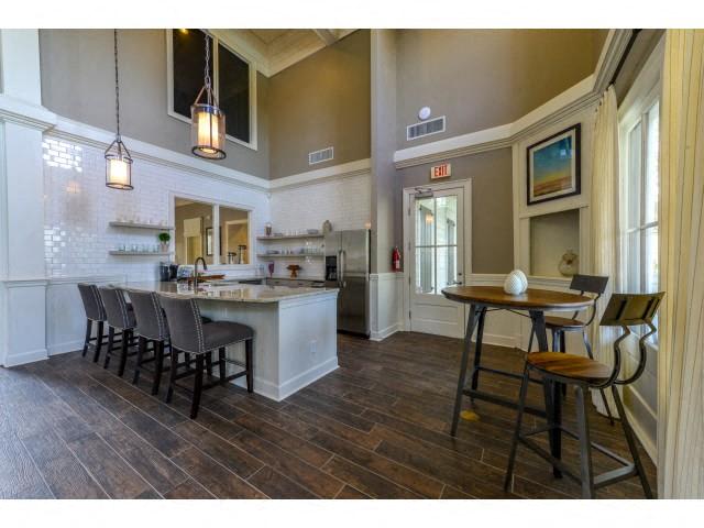 Stunning Modern Design Community Clubhouse with Ample Space and Amenities like Coffee Bar and Fireplace Lounge at Legacy Farm Apartments