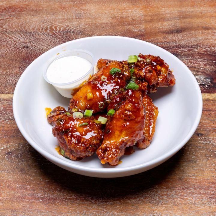 Jumbo wings tossed in Paisans Sweet and Spicy Dragon Sauce 