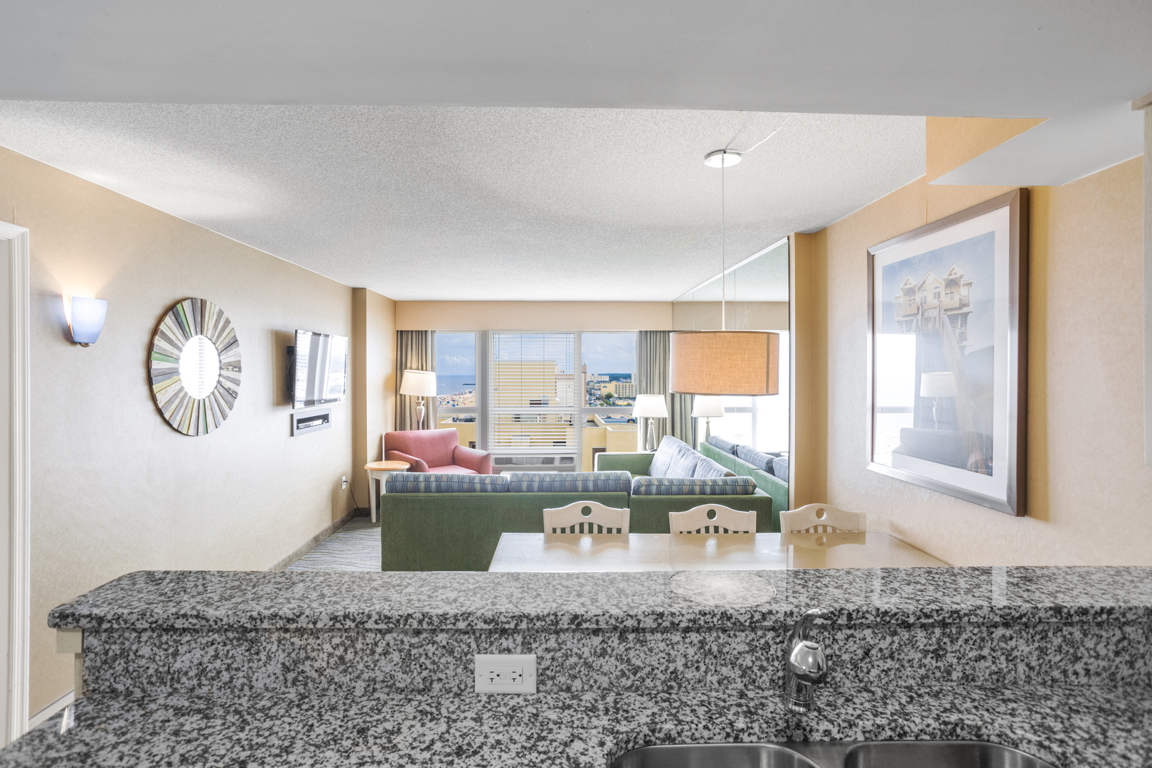 The kitchen view of an accommodation at Boardwalk Resort and Villas. It features a partial city and ocean view.
