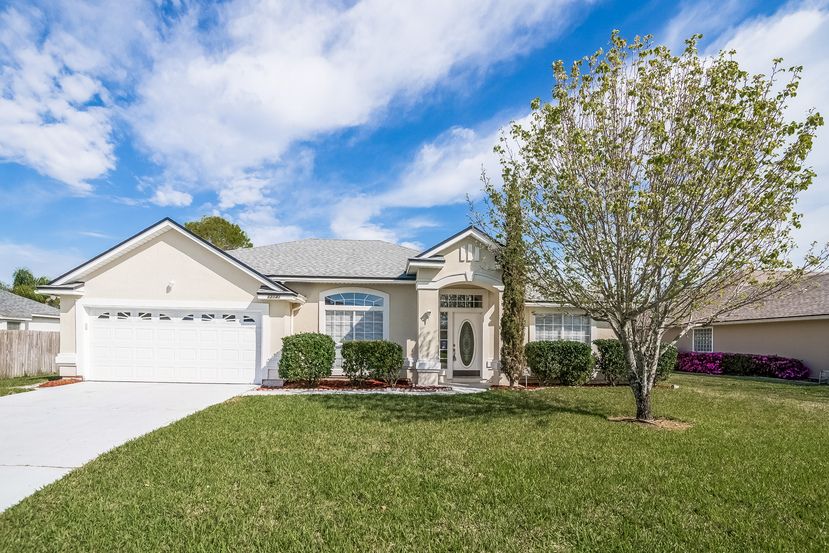 Charming home with long driveway and two-car garage at Invitation Homes Jacksonville.