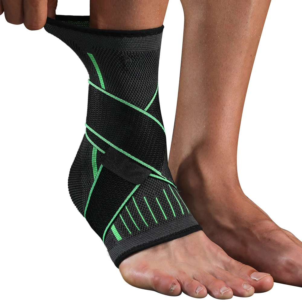 A close-up shot of a person's foot and ankle wearing a black and green athletic ankle brace, with a white background.
