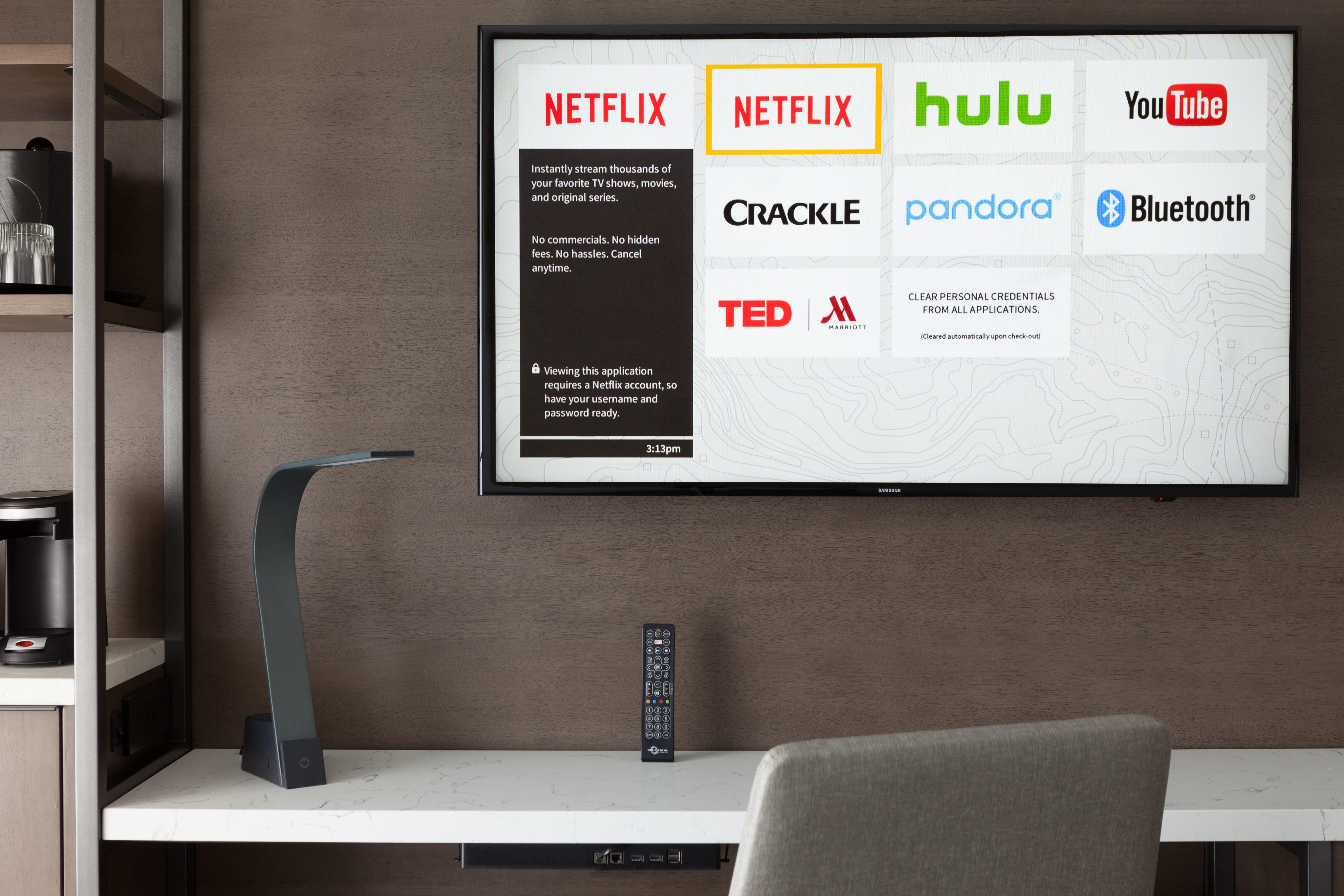 Watch Netflix, Hulu, Crackle and more on your Smart TV, mounted on the wall above your desk.