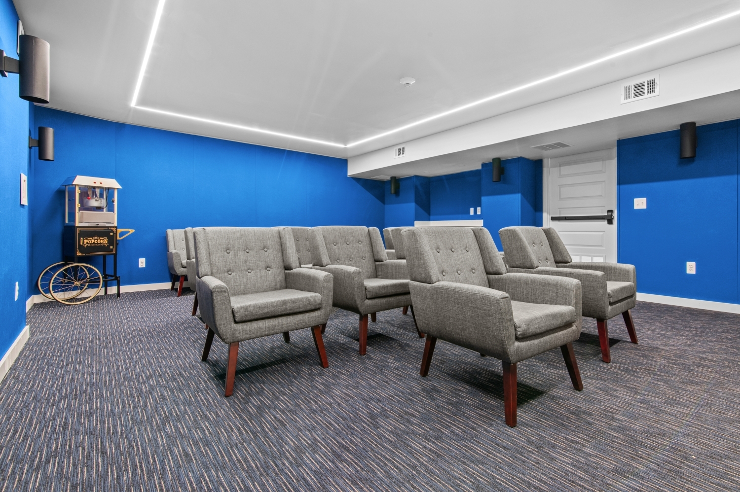 This image showcases the comfortable resident theater room at Solaire Senior Living in Southfield, MI, a welcoming space where residents 62 years of age and better can relax, watch movies, and enjoy community entertainment. The cozy seating, modern lighting, and inviting atmosphere create the perfect setting for movie nights, social gatherings, and resident events. As part of this luxury senior apartment community, amenities like the theater room enhance the lifestyle at Solaire by encouraging connection and leisure.