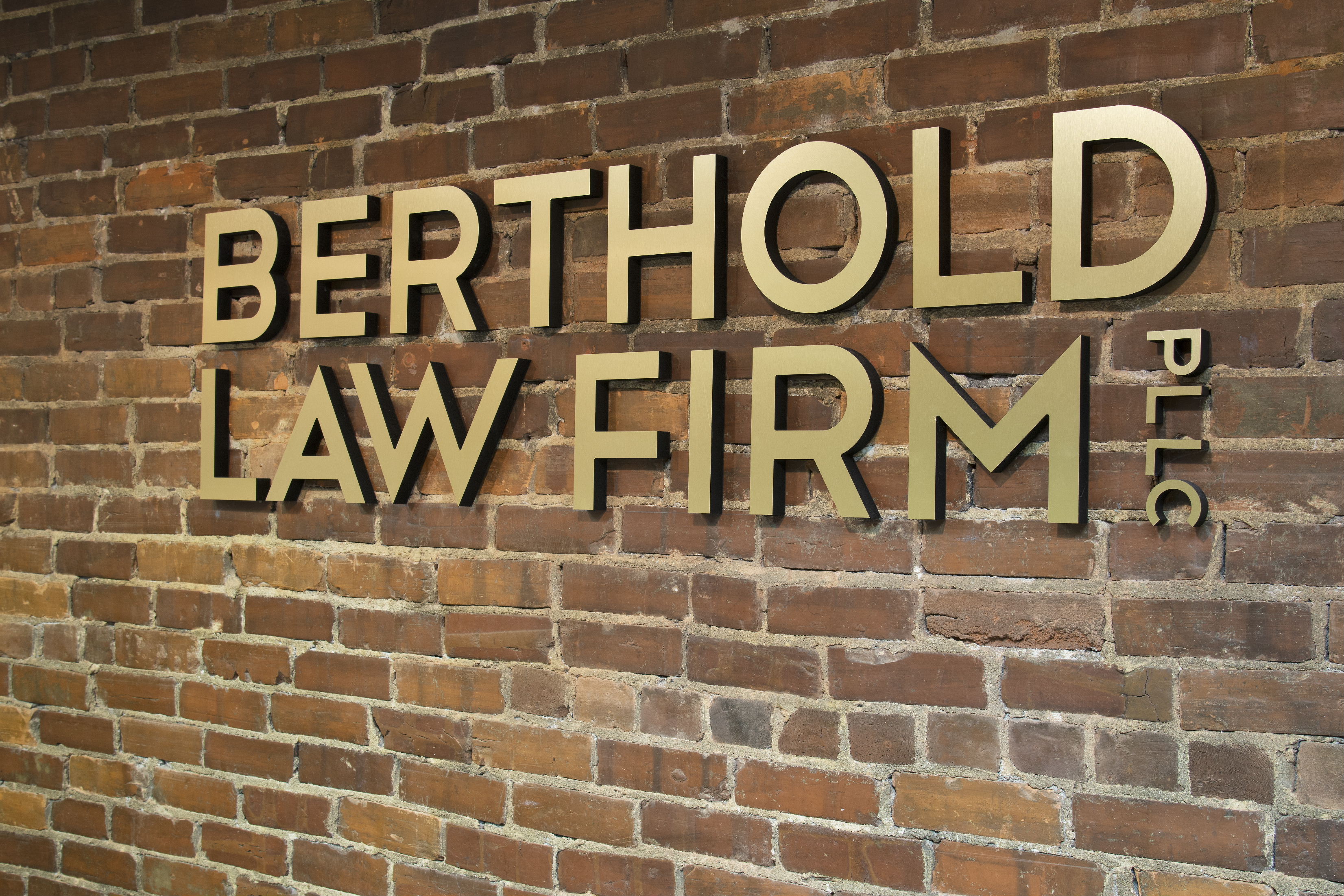 Interior sign for Berthold Law Firm.