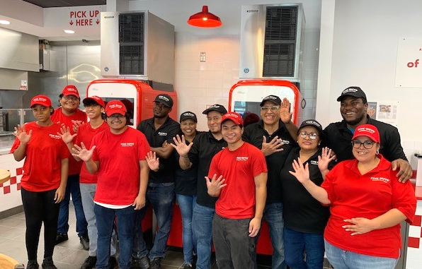 Crew members pose for a photo at the Five Guys at 21 East Broad Street in Westfield, New Jersey.