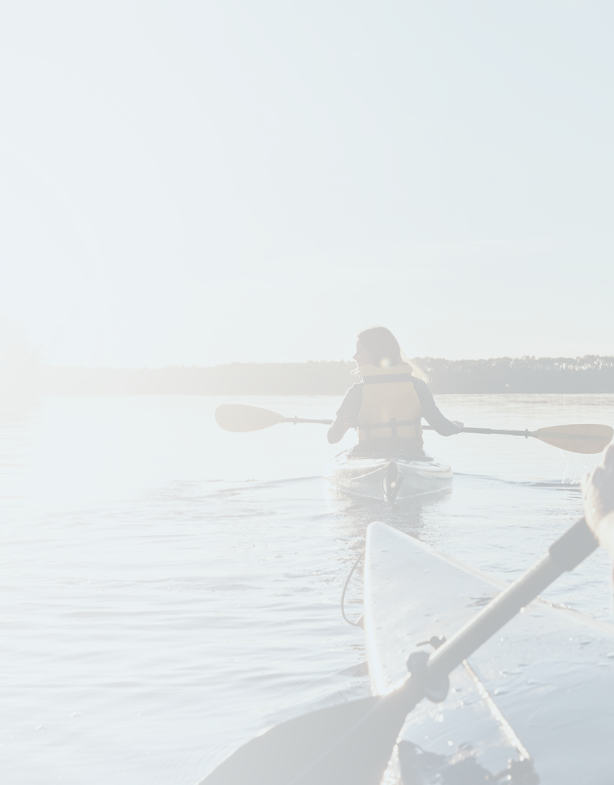 Two people kayaking on a sunny day.