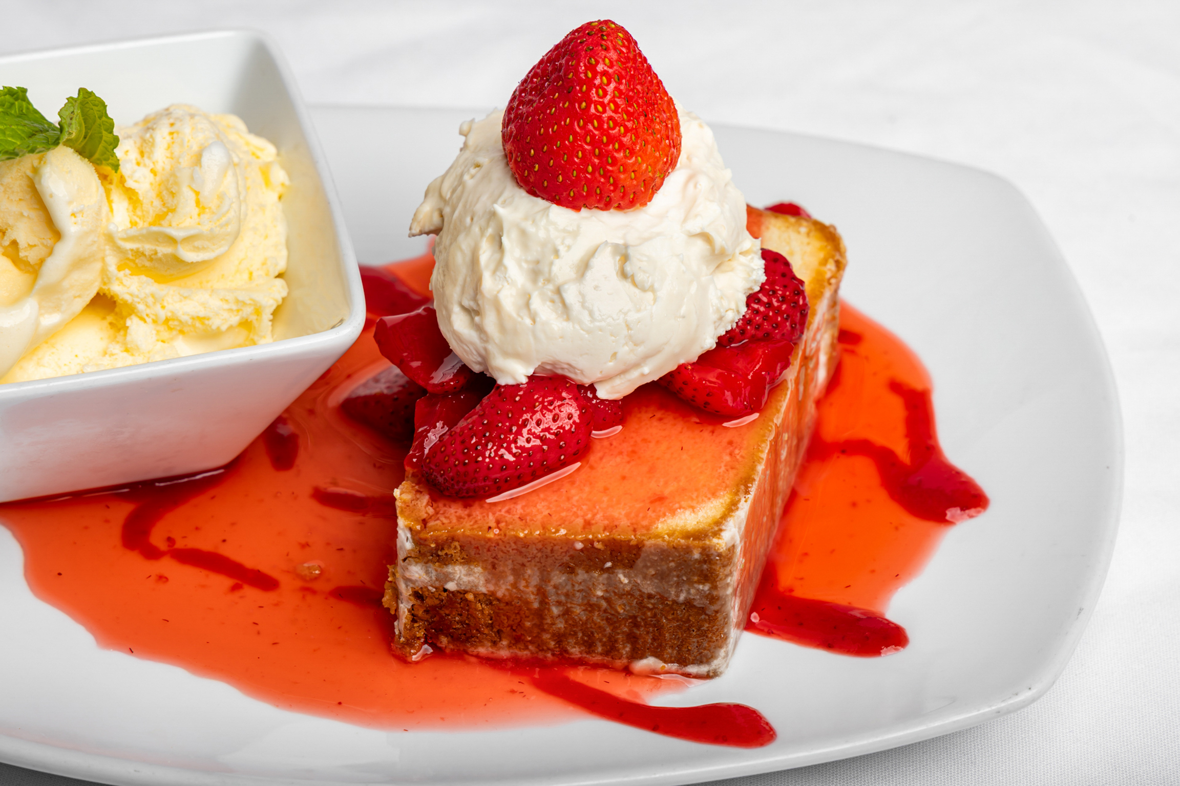 A sweet finish with soft, rich cake paired with creamy ice cream.