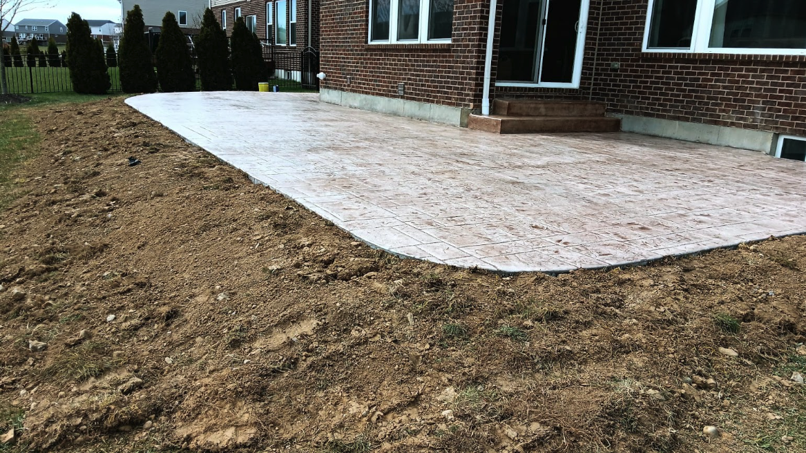 This home in Mason, Ohio had a deck that was beginning to fall apart. Instead of replacing it, the owners chose to go with a new stamped concrete patio. We used a stamp that looked like stone blocks, then stained the surface with a light brown color. Does your patio or deck need an upgrade? Reach out for a FREE estimate.