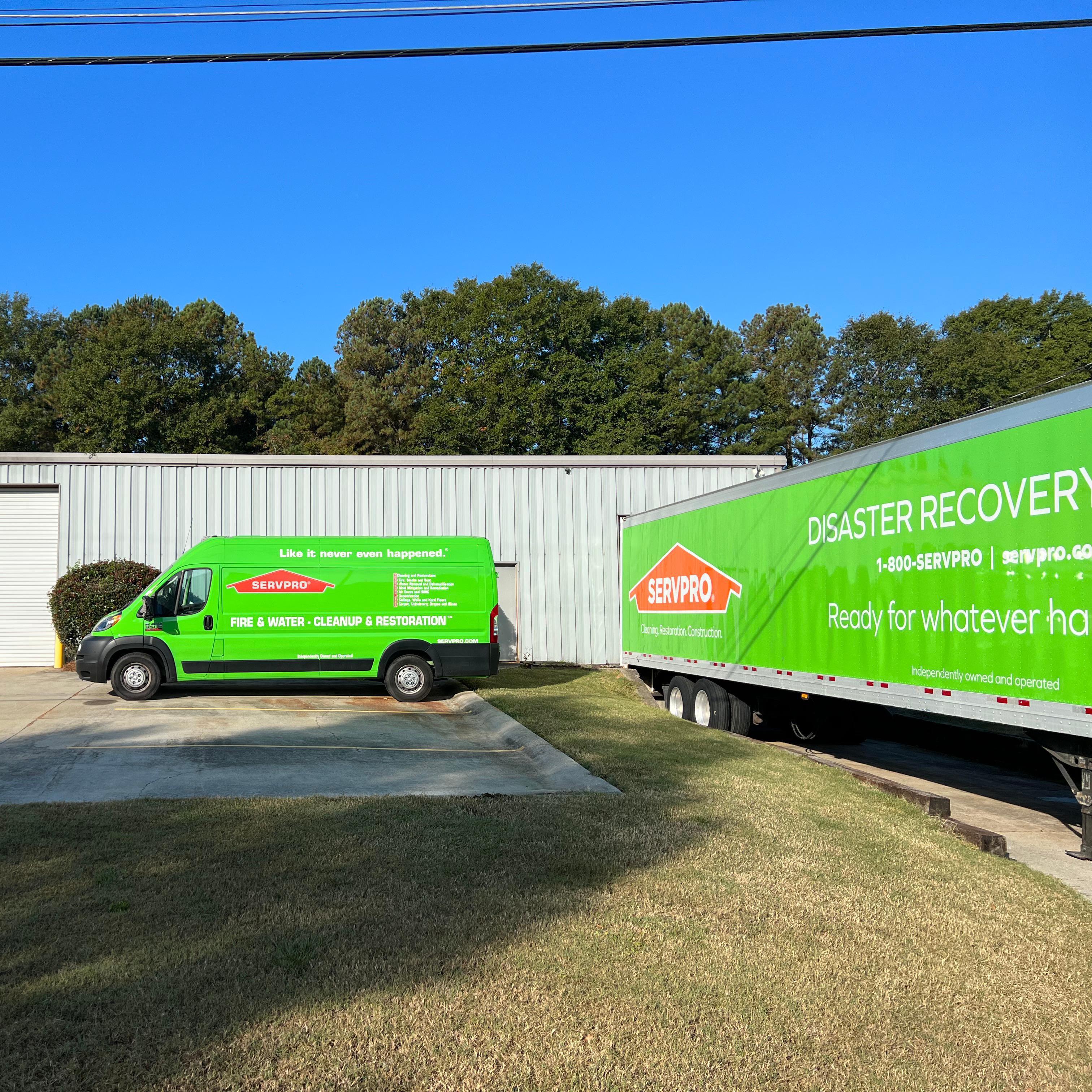 Two SERVPRO of Jackson and Madison Counties trucks in the parking lot.