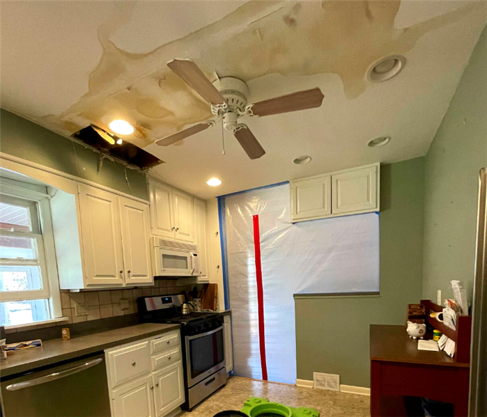 Ceiling water damage in Northford, Connecticut caused by a toilet overflow on the above floor.
