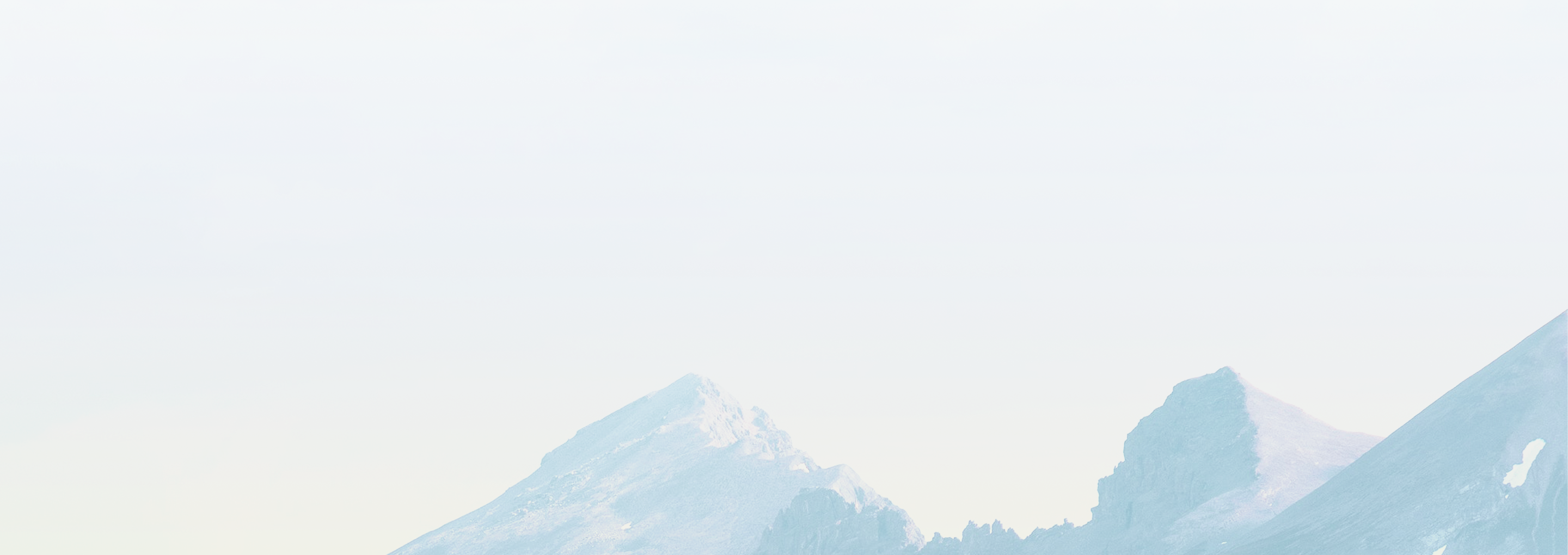 Rugged, snow-capped mountain peaks.