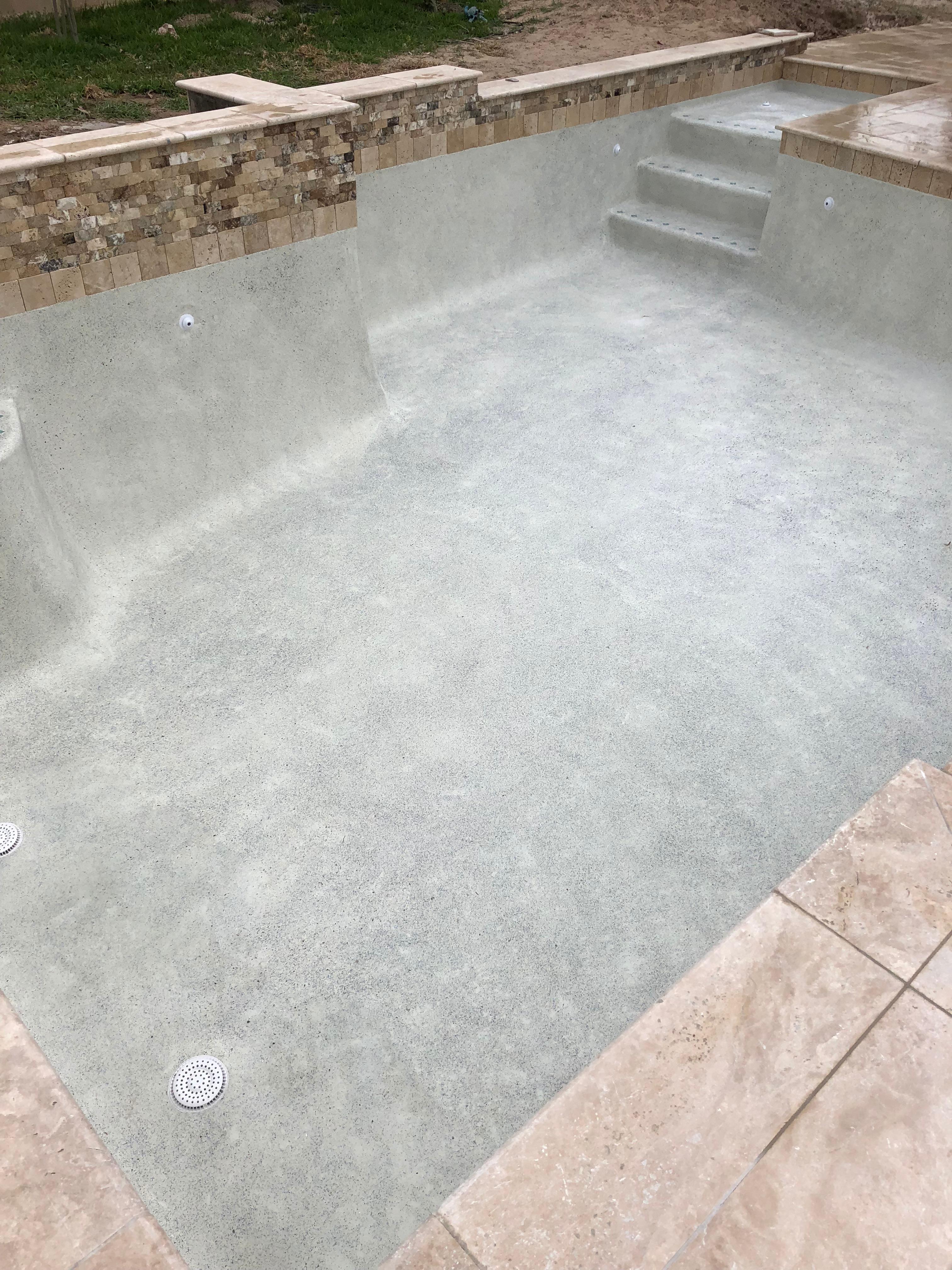 Stone Scapes mini pebble  aqua cool plaster with abalone shells Spring Tx Toscano Pool Plastering Pasadena (832)964-7237
