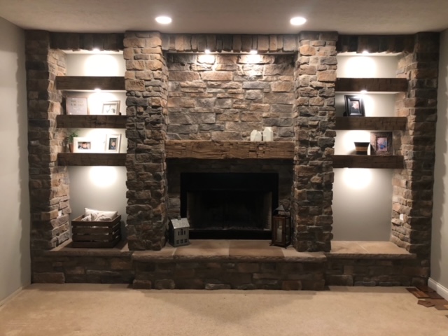 Putting 6 of these 3 inch Reclaimed wood shelves that are laid between this amazing stone work, done by home owner!
And they chose an old Reclaimed Barn Beam for their Fireplace Mantle. Nice job!