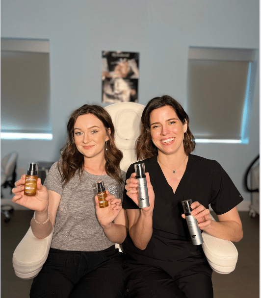 aestheticians holding professional products at Bentley Skincare & Wellness