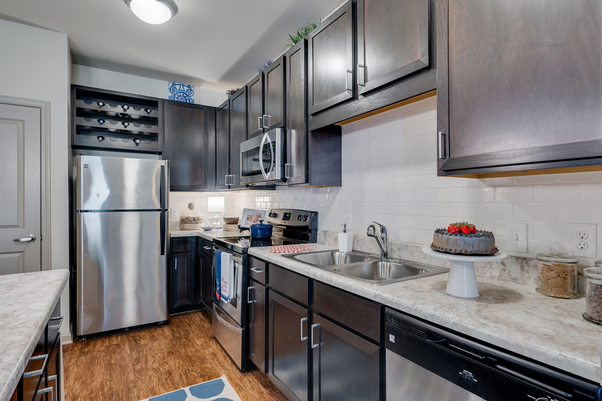 Fully-Equipped Kitchen With Espresso Cabinets & Stainless Steel Appliances