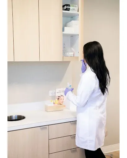 Medical professional preparing advanced aesthetic and Women’s Wellness Institute of Dallas treatments in a clinical setting, supporting personalized cosmetic gynecology and skin care services.