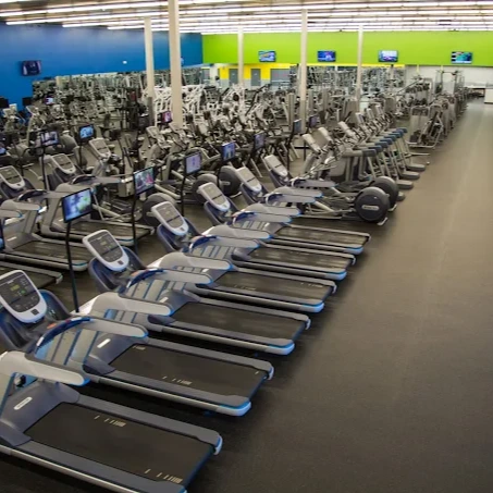 Row of treadmills at 10GYM South Tulsa for cardio training, walking, and running workouts.