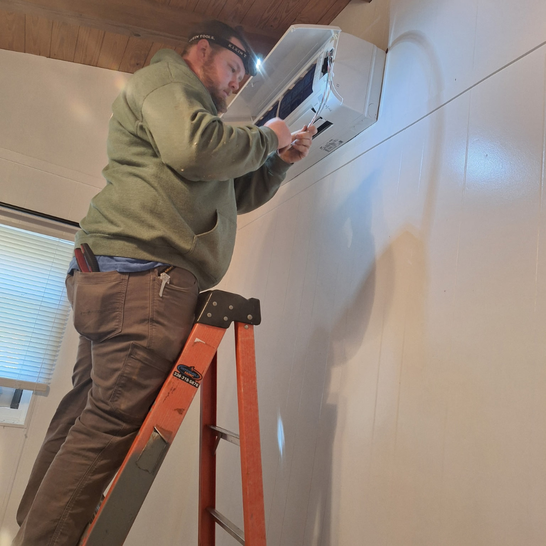 Dependable HVAC technician installing a ductless mini-split air conditioning unit in Albemarle, NC. Professional cooling system installation for homes and businesses.